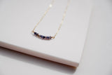 Our gold strand necklace with iolite