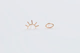 Our pair of gold open eye studs, one eye is open and the other is winking 